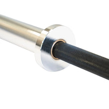 Load image into Gallery viewer, Close-up of a Texas Power Bar Elite barbell handle with textured grip on a white background