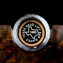 Load image into Gallery viewer, Texas Dead Lift Bar Cap on a wooden surface with a black background